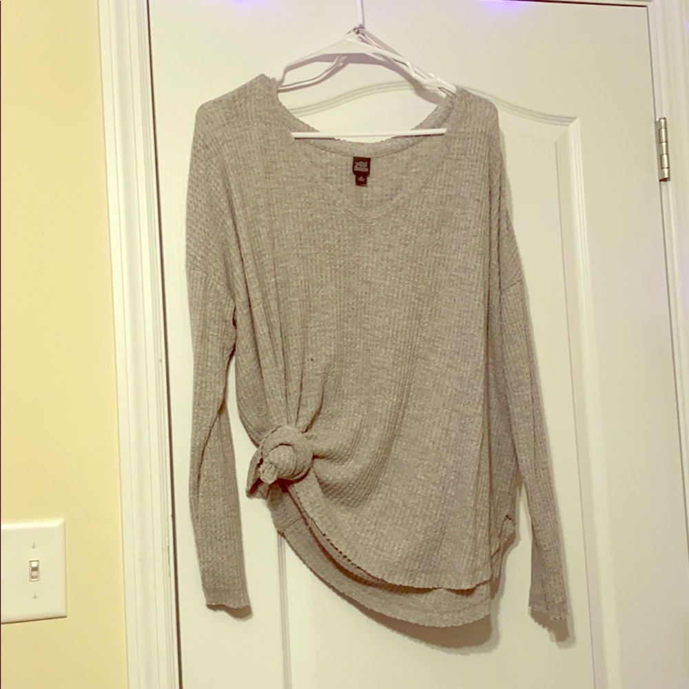A light gray sweater